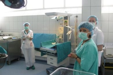 staff pictured, medical equipment in the background